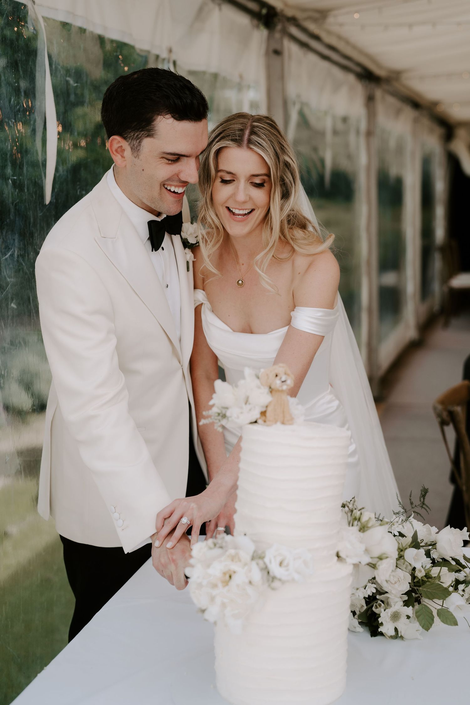 bride and groom cutting wedding cake at hamswell house wedding in bath