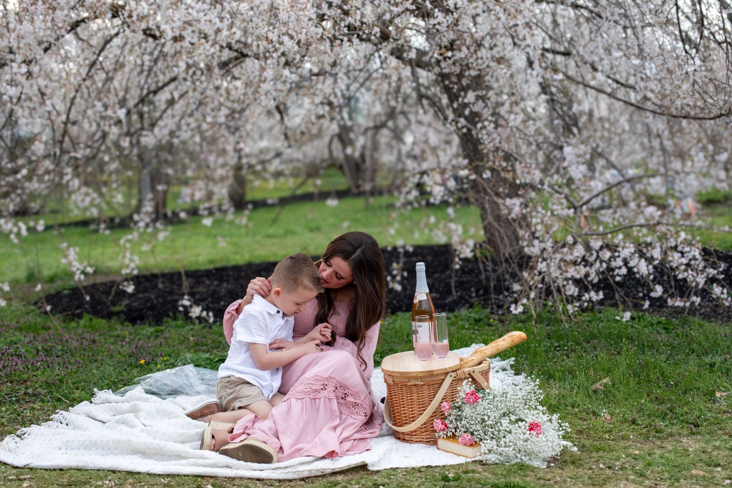 mom and son Ault Park Cincinnati affordable picnic photoshoot styled under cherry blossom trees mommy and me mother's day photoshoot outdoor