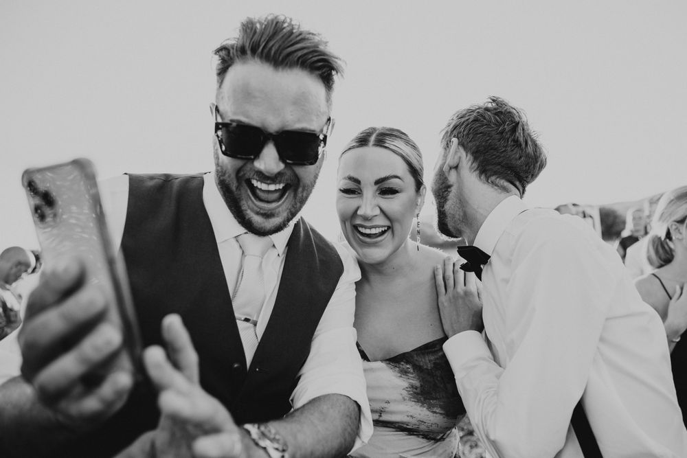 wedding reception outdoor , guests having fun