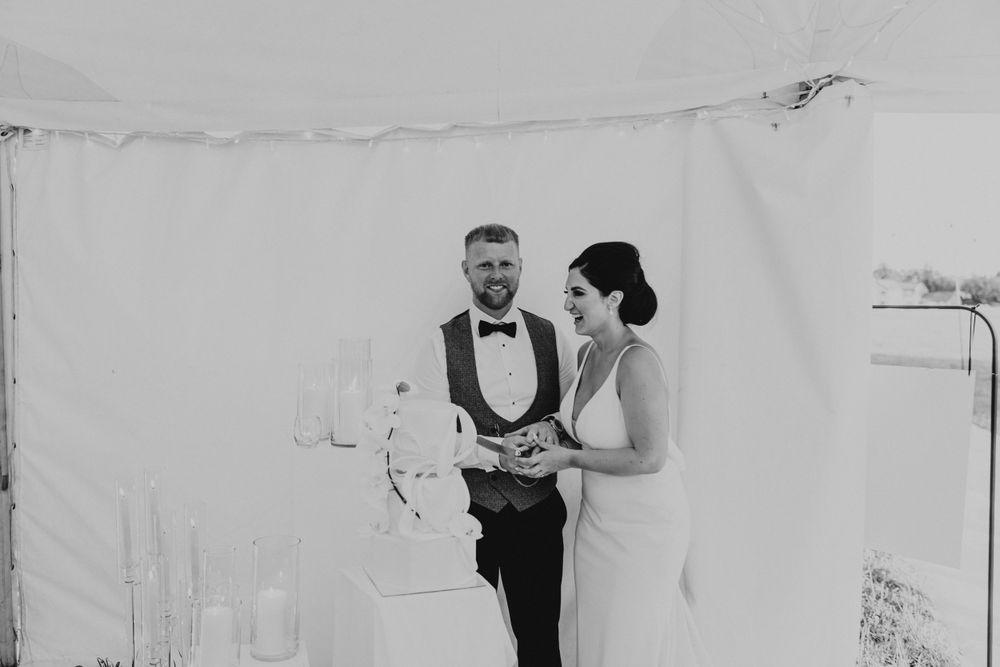 Bride and groom cutting the cake