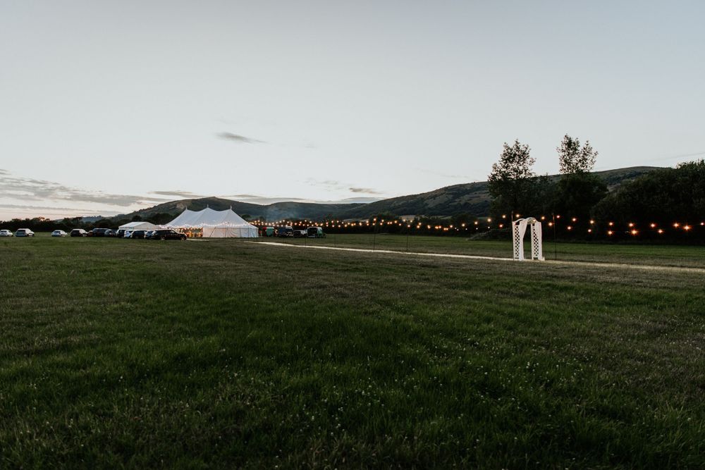 blue hour marquee wedding in somerset with stunning views over hill
