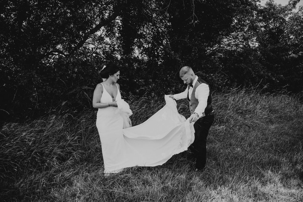 forest background . Bride and groom getting read for portrait session