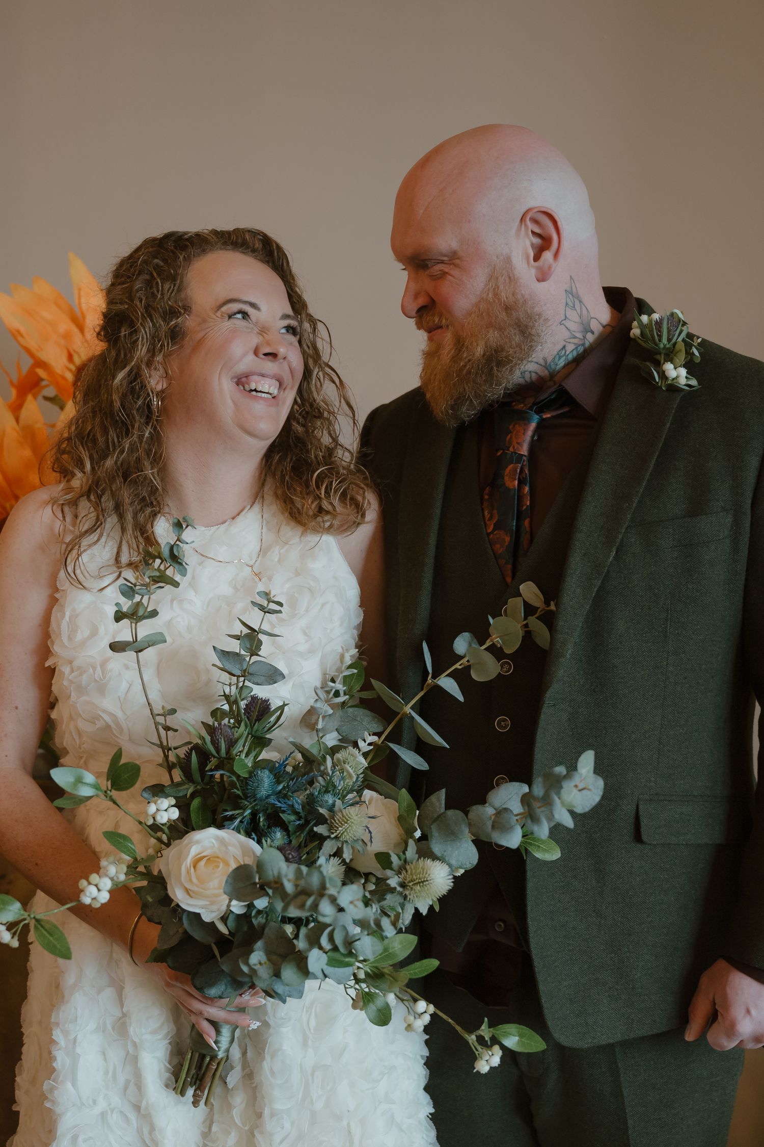 A romantic wedding moment captured in a series of candid photos showing joyful laughter and natural eucalyptus bouquet details.