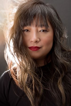 Portrait series showing dramatic lighting on dark hair with red lipstick against black background.