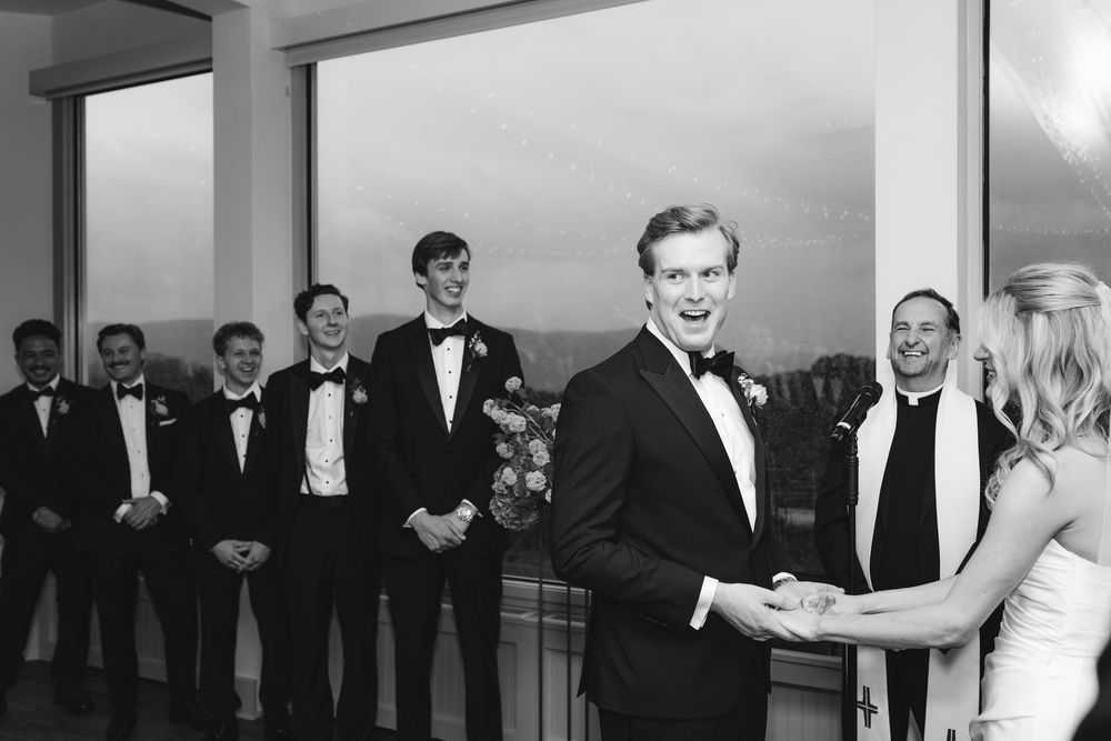 A black and white photo montage showing formal wedding party moments with people in tuxedos and formal attire.