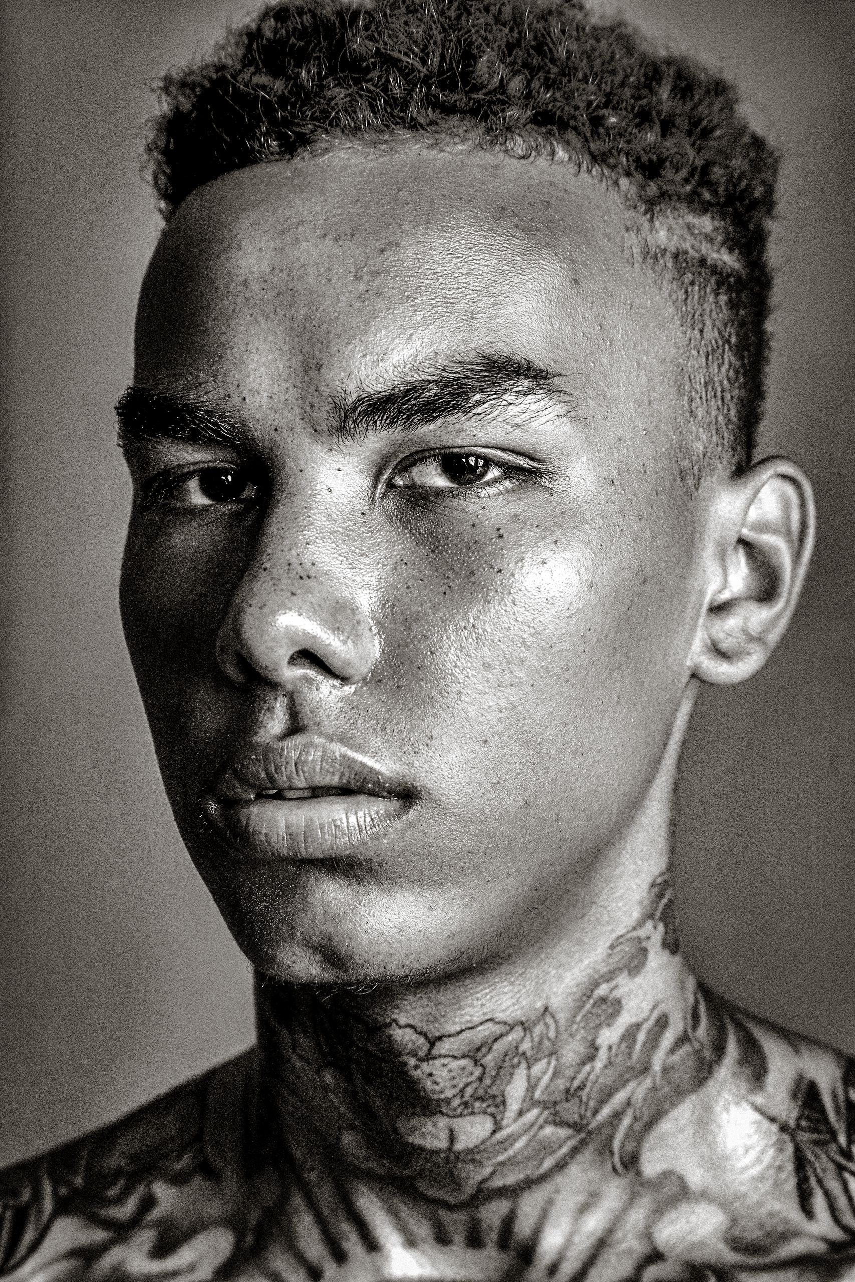 A series of close-up black and white portrait shots showing artistic shadows and dramatic lighting.