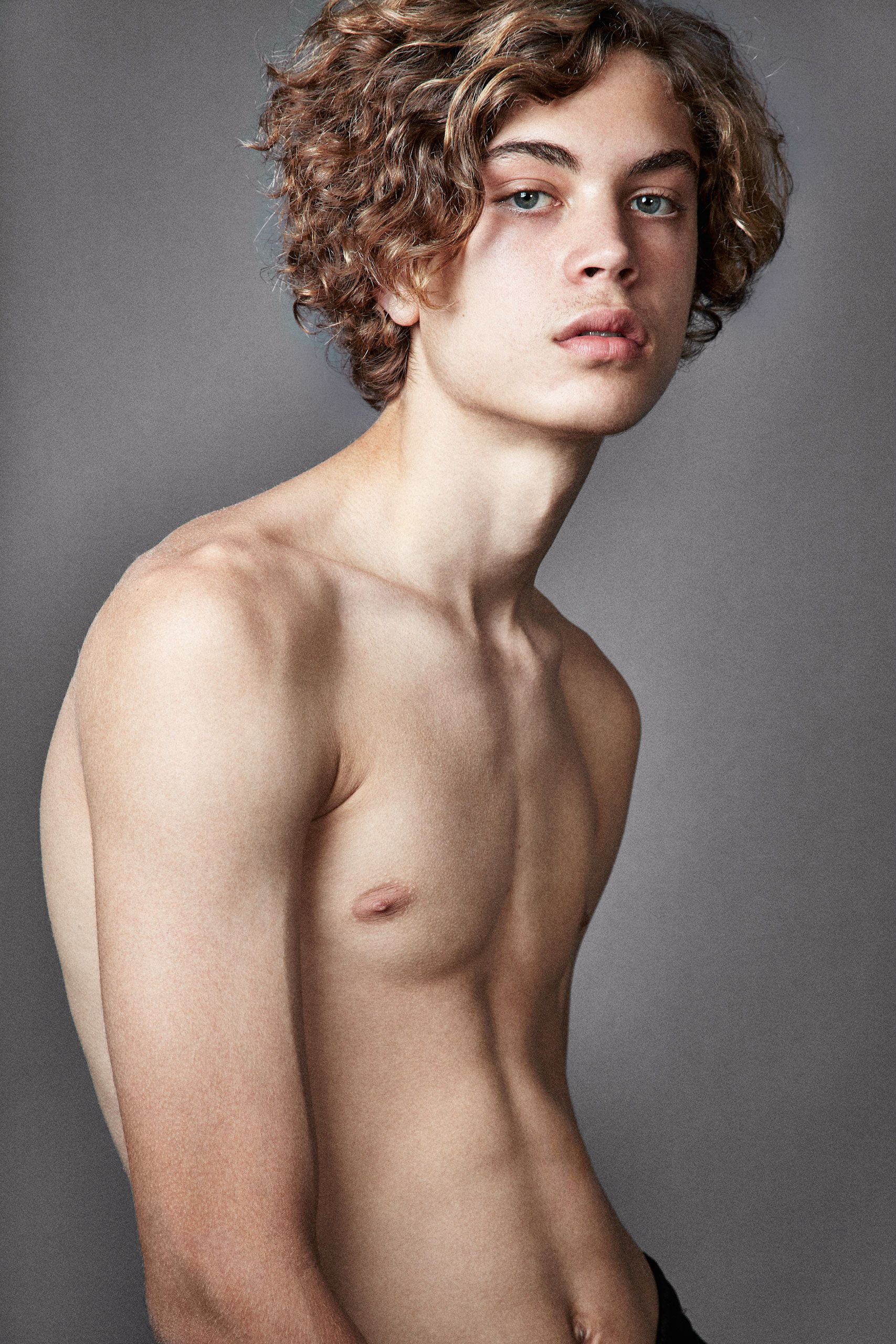 Artistic black and white portrait series showing different angles of a shirtless person with curly hair against gray backdrop.