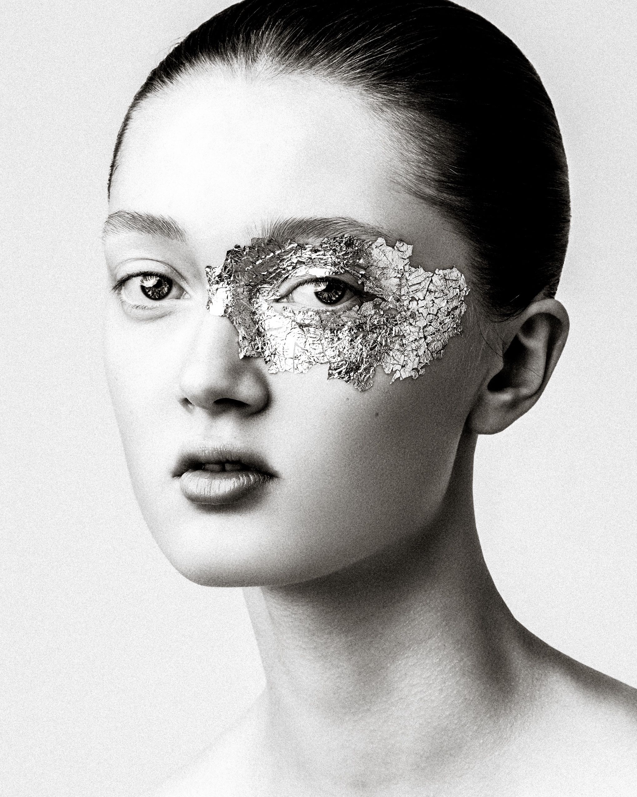 Artistic black and white portrait series featuring glittery eye makeup across four similar compositions.