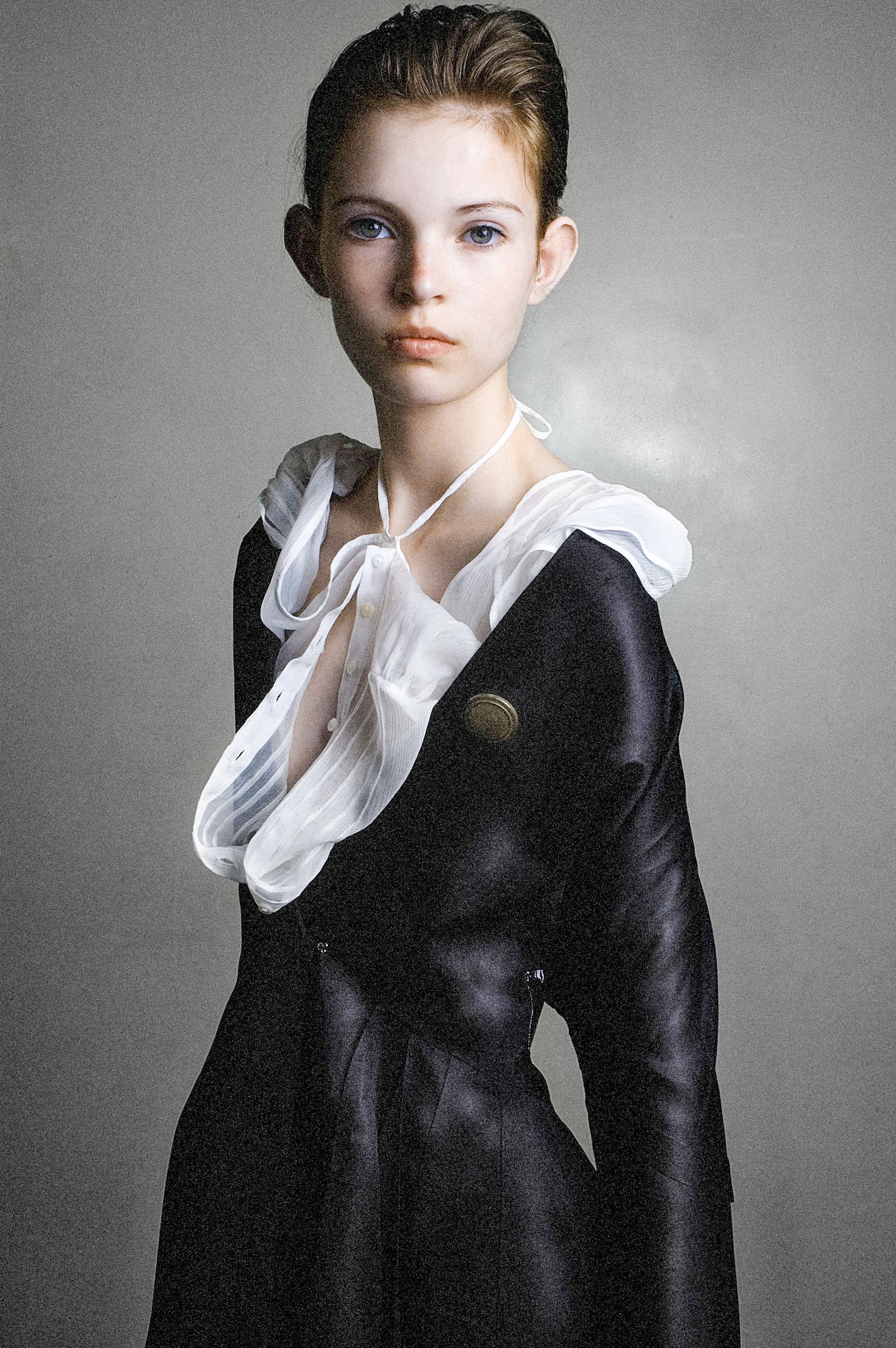 Fashion editorial series featuring classic black and white styling with white collar details.