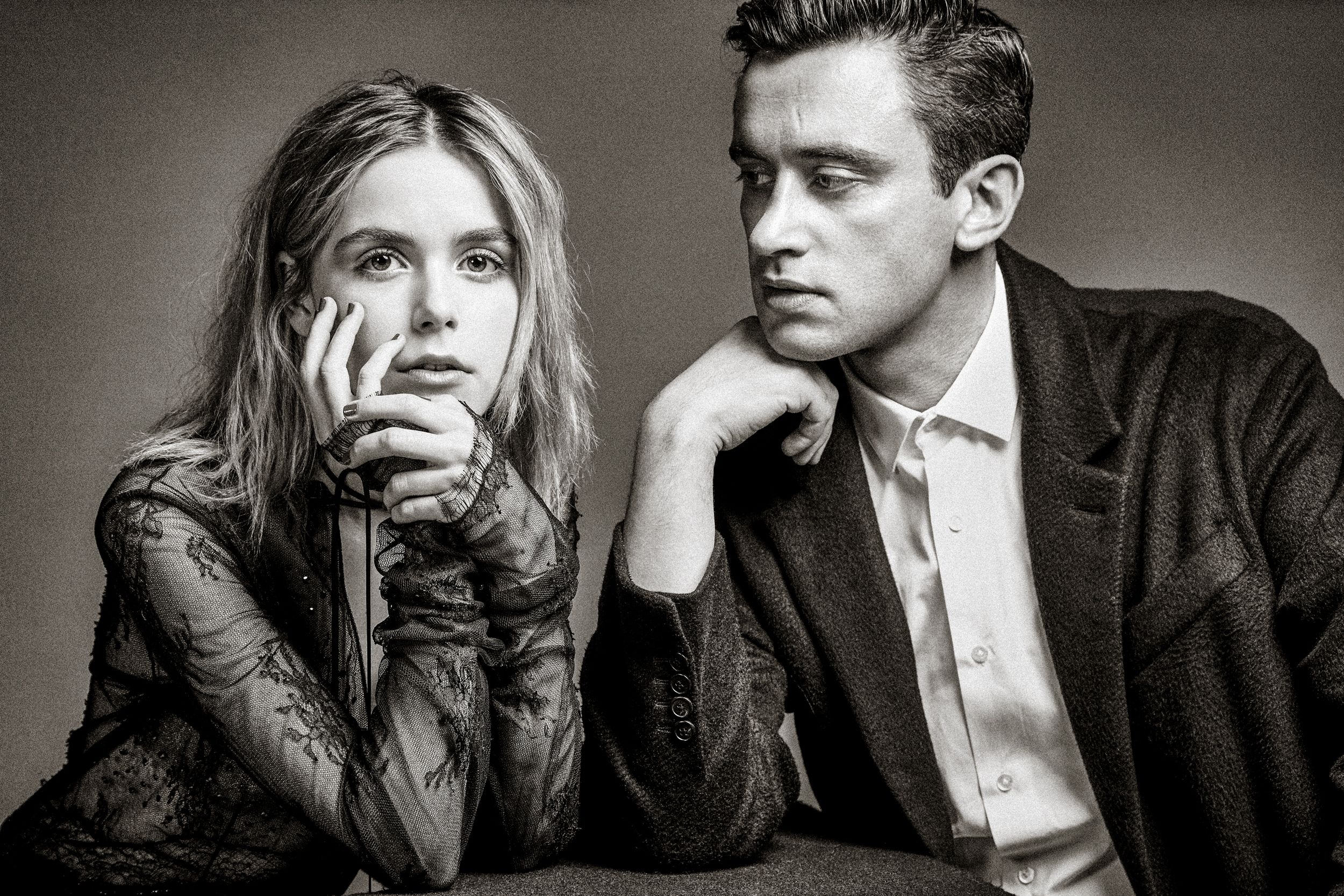 A series of black and white portraits showing intimate couple poses in formal attire against a dark background.
