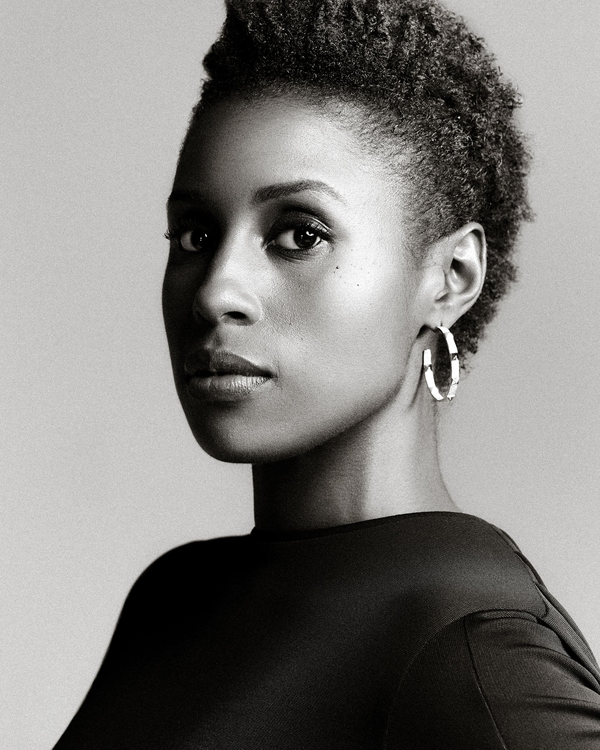 Artistic black and white portrait series showing different dramatic angles and lighting on a person with natural hair.