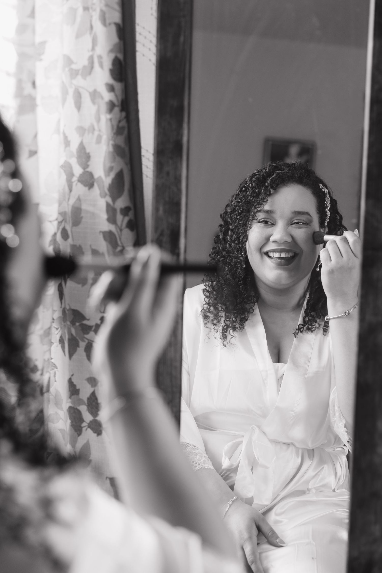 A series of black and white portraits showing joyful expressions in white attire.