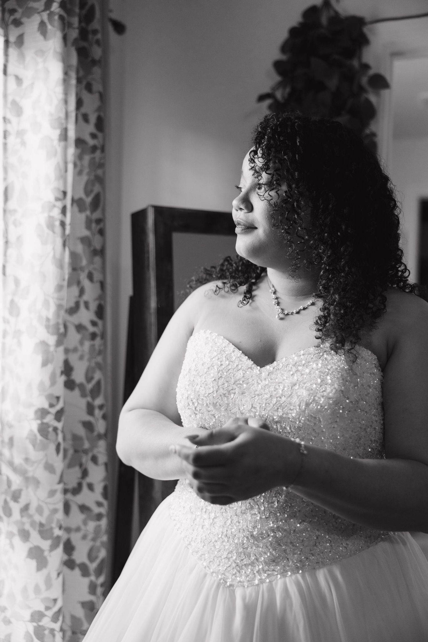 Series of artistic black and white bridal portraits showing details of a beaded wedding dress.