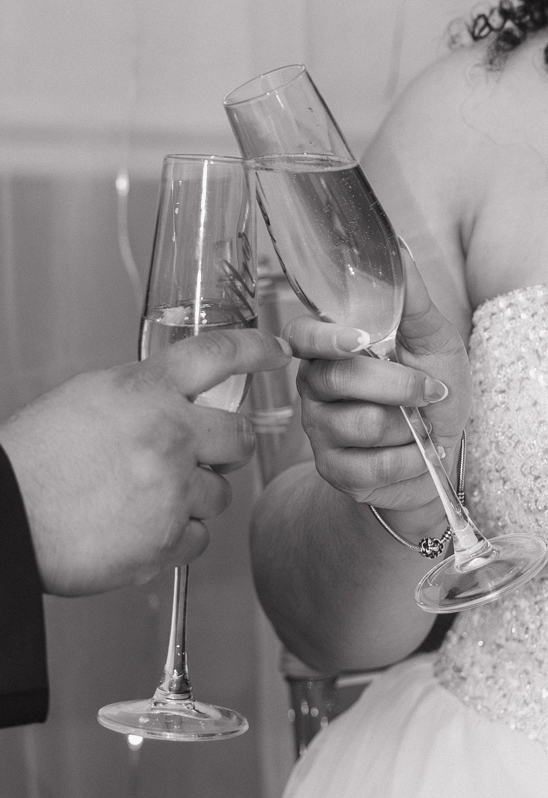 Black and white photos of wedding toast moments with champagne glasses.