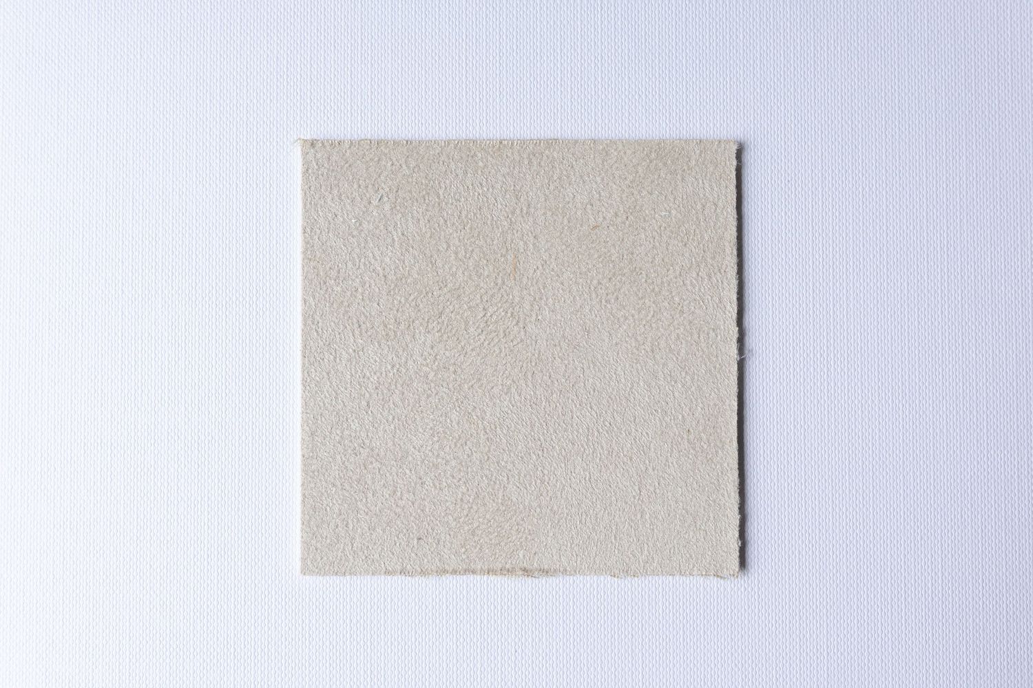 A series of brown leather or suede material swatches arranged in a row against a light gray background.