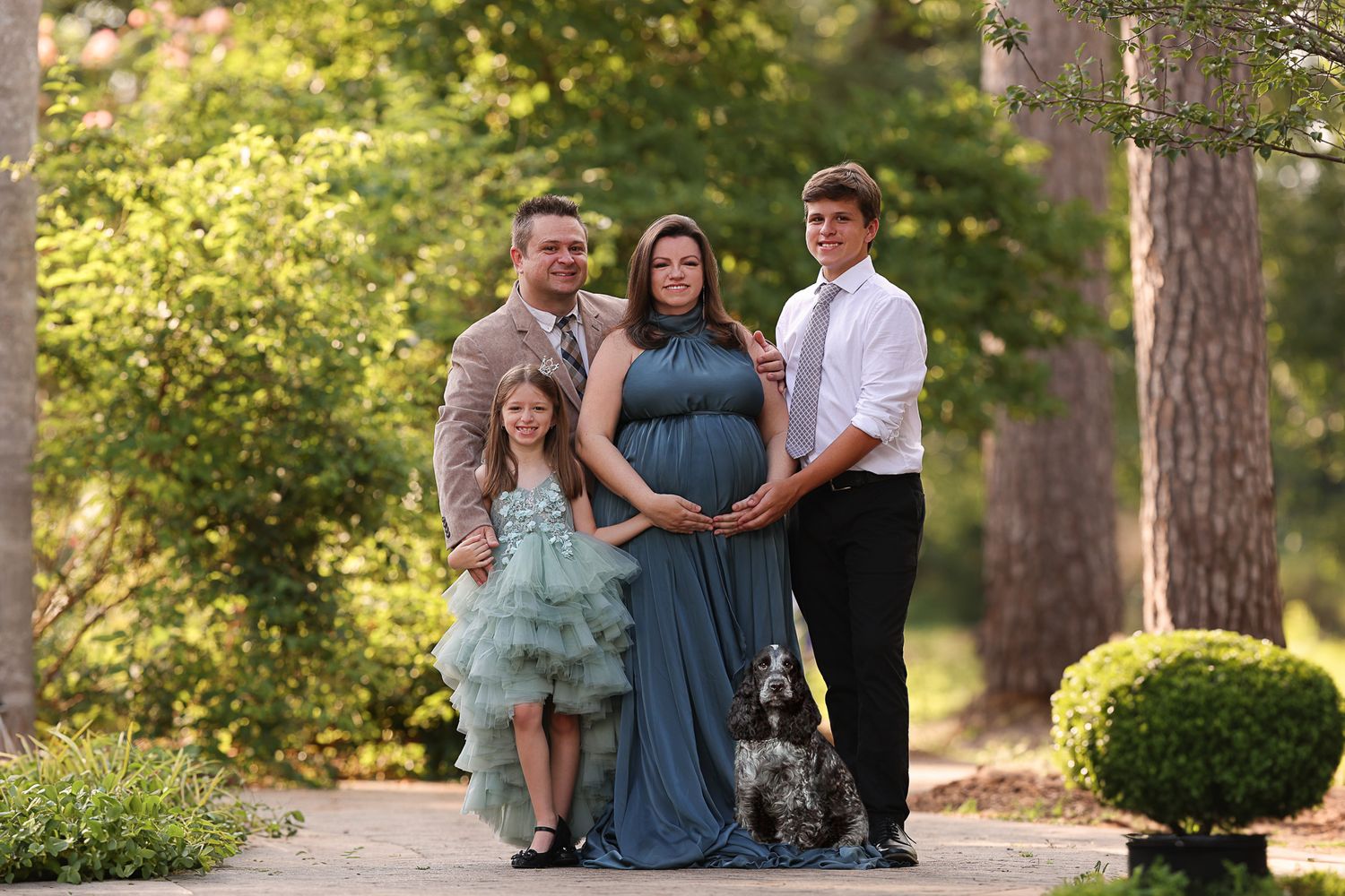 Family enjoying winter scenery on snowy mountain slope in sunlight. – newborn photographer Paloma Schell Houston TX