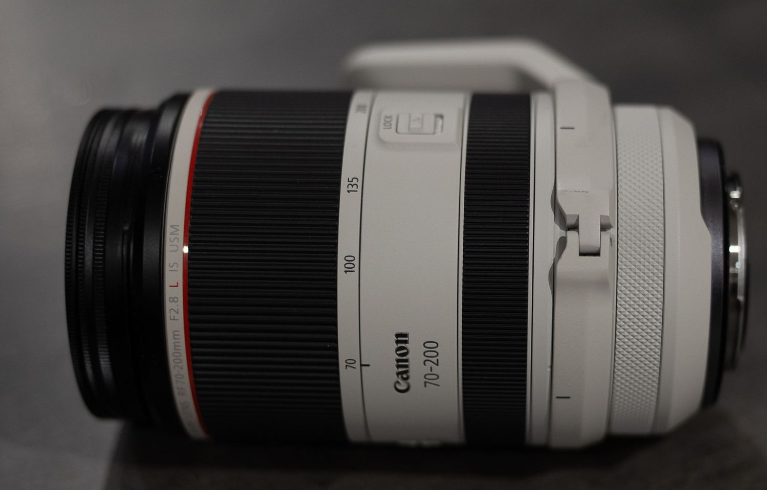 A Canon RF 70-200mm f/2.8 L IS USM telephoto zoom lens shown in white with red ring detail.