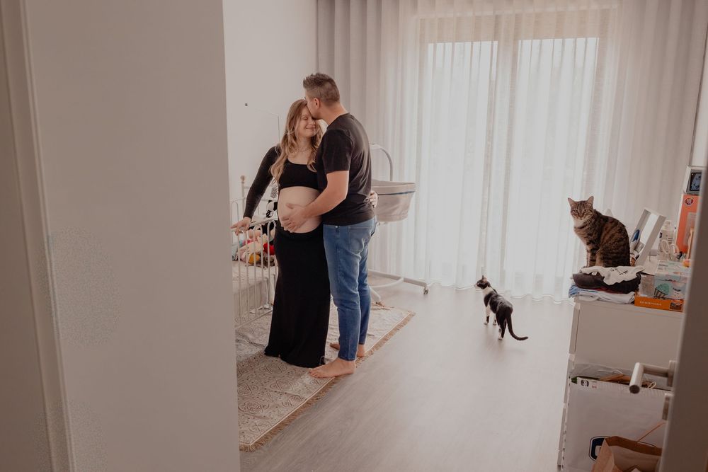 A series of photos showing a person holding and caring for a small brown puppy in a home setting.