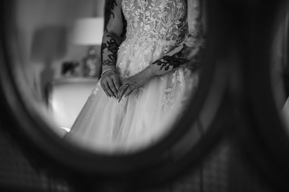 Black and white artistic photograph showing decorative mirrors creating a dramatic shadow effect.