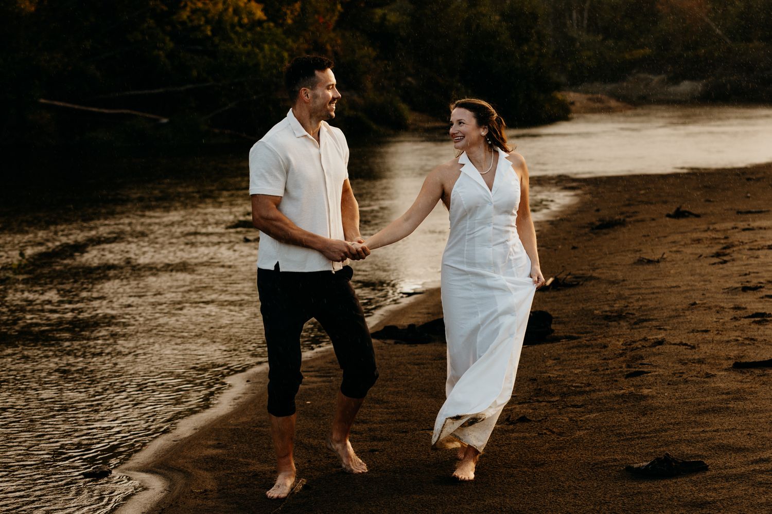 Dreamy golden hour engagement photos with sun flares through trees.