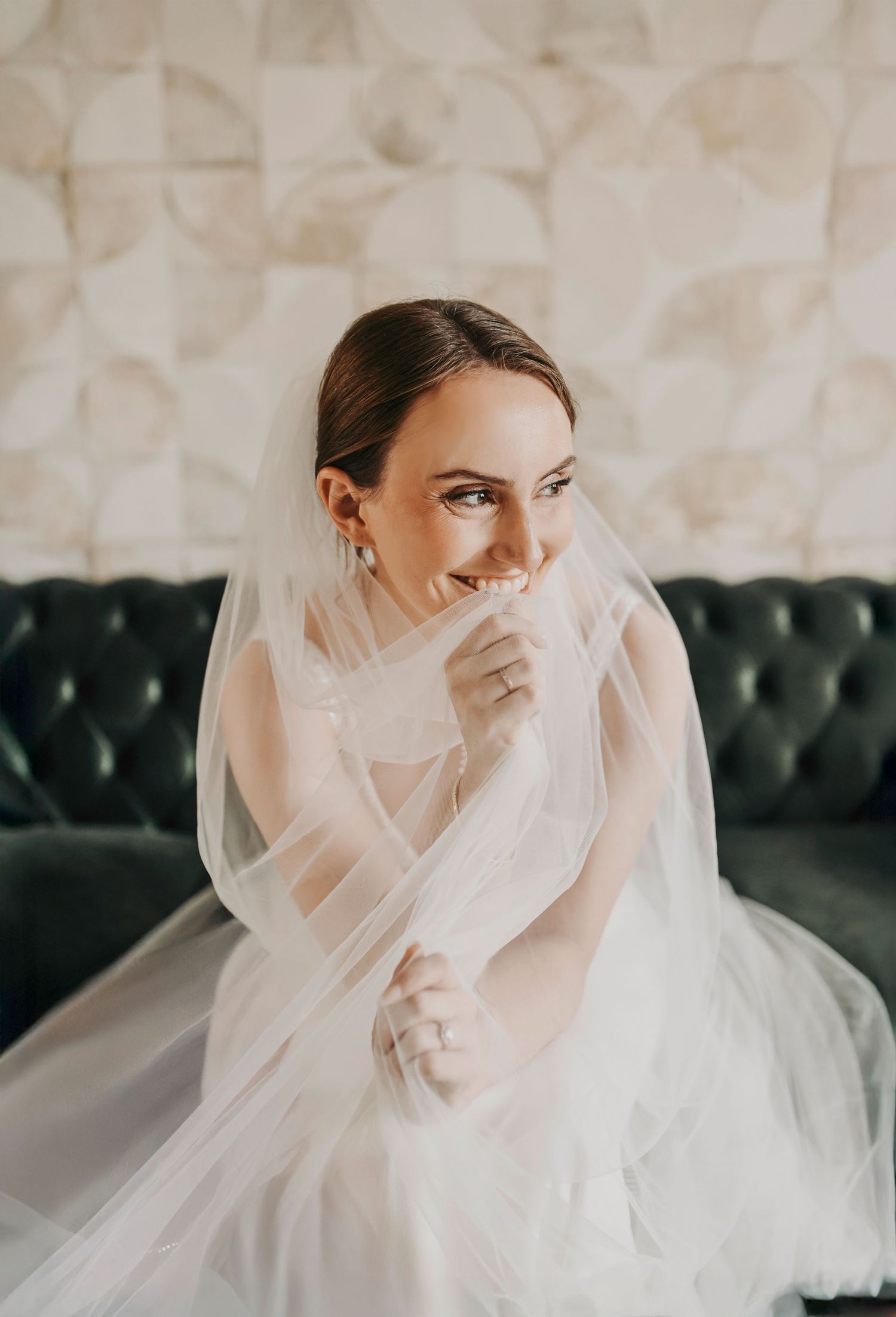 Elegant bridal portrait of a Dallas bride in her wedding gown captured in natural light before the ceremony.