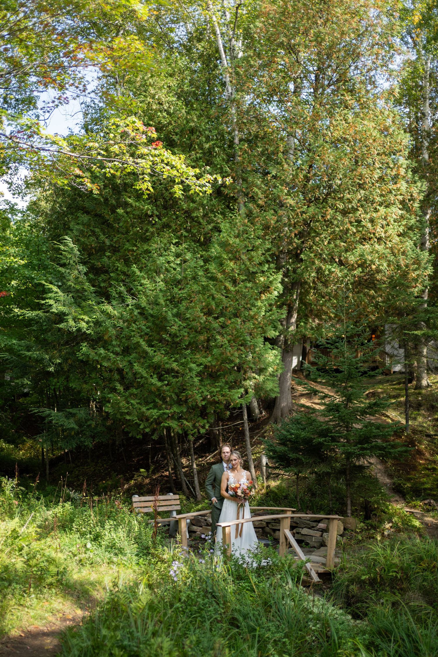 A scenic garden pathway winds through lush greenery and trees in a tranquil outdoor setting.