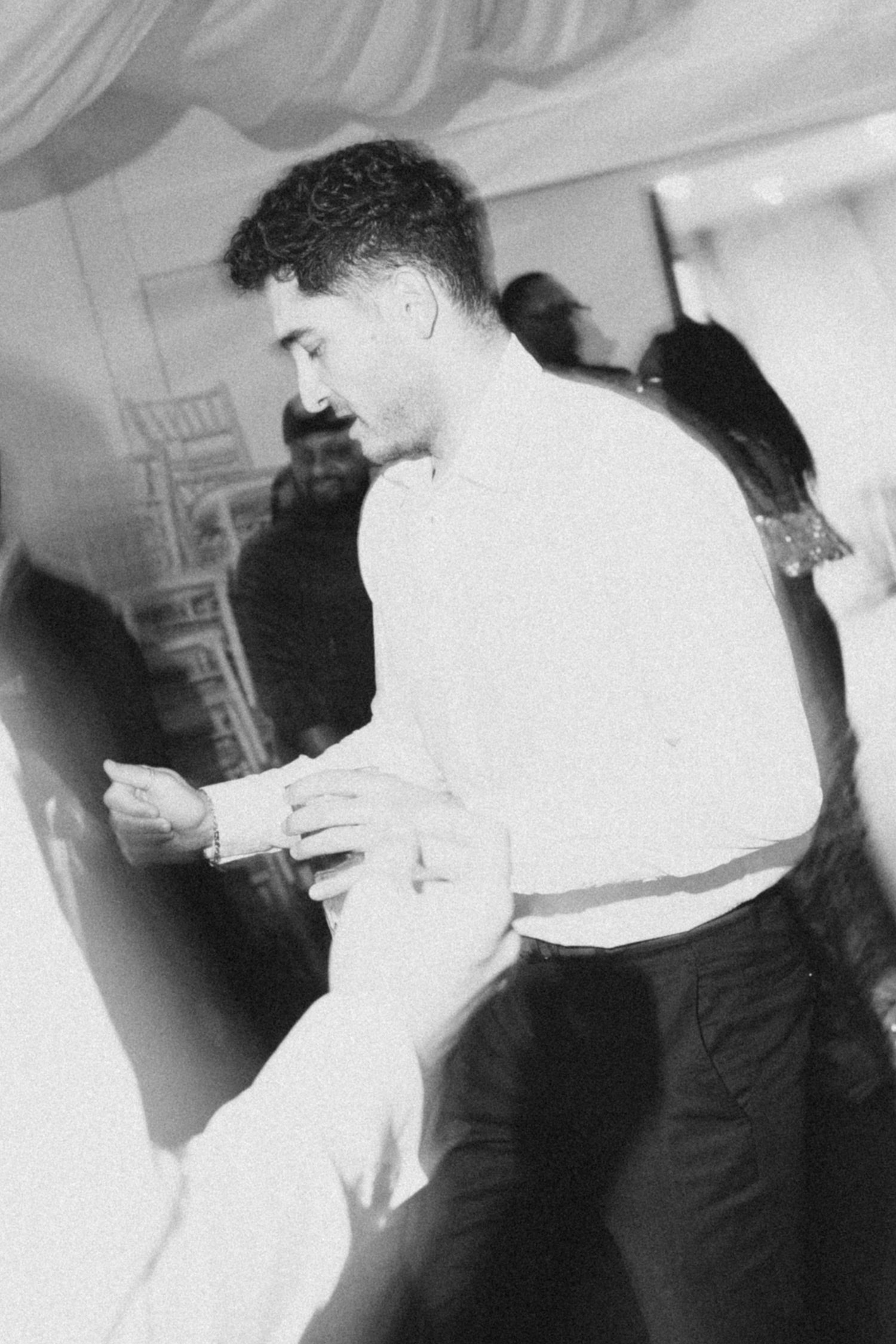Black and white photos showing couples dancing at a formal event with elegant movements.