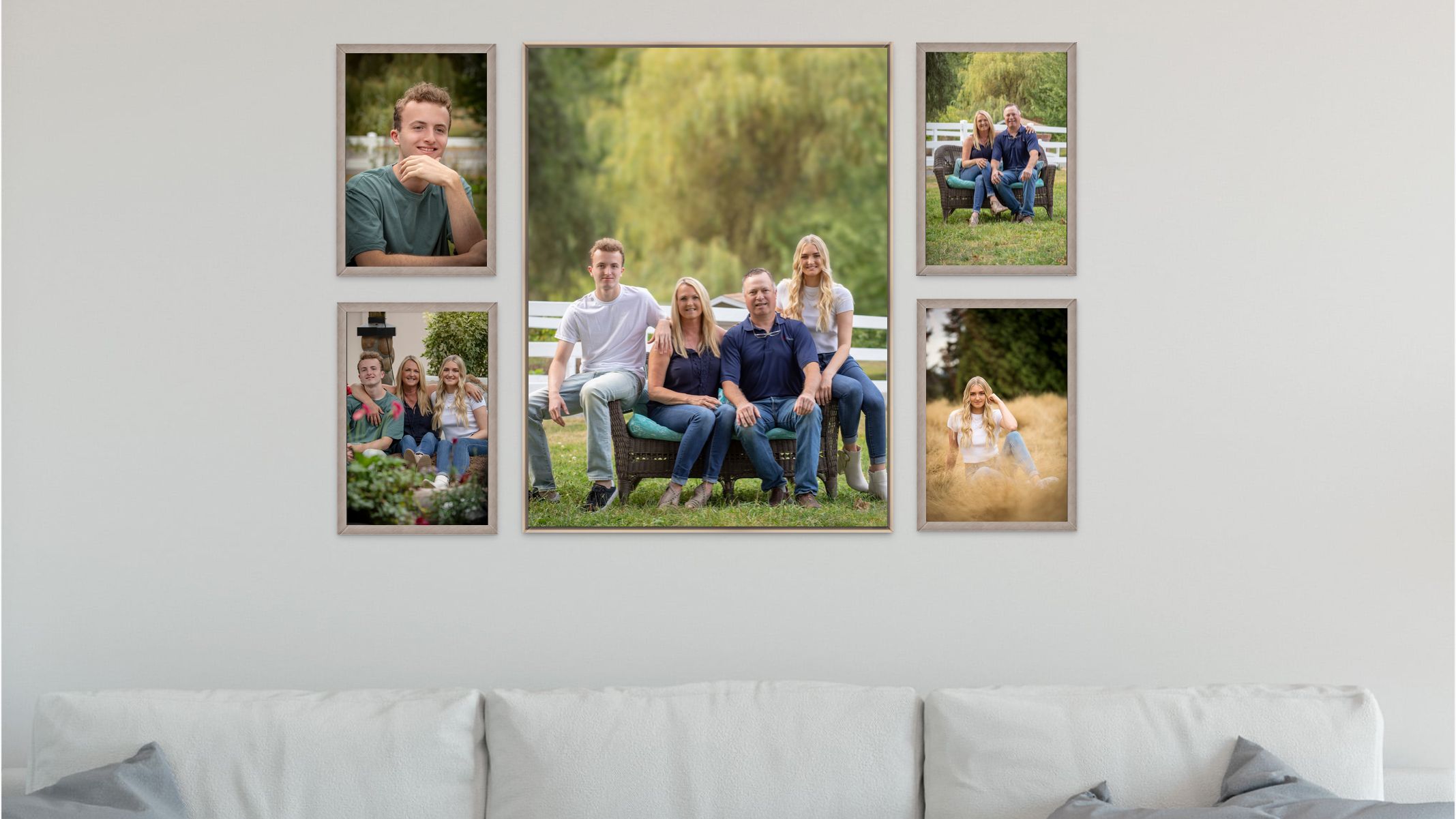 A collection of family photos arranged as a gallery wall display above a gray couch.