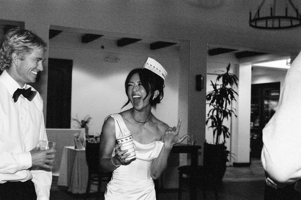 A black and white photo collage showing multiple candid moments at what appears to be a wedding celebration.