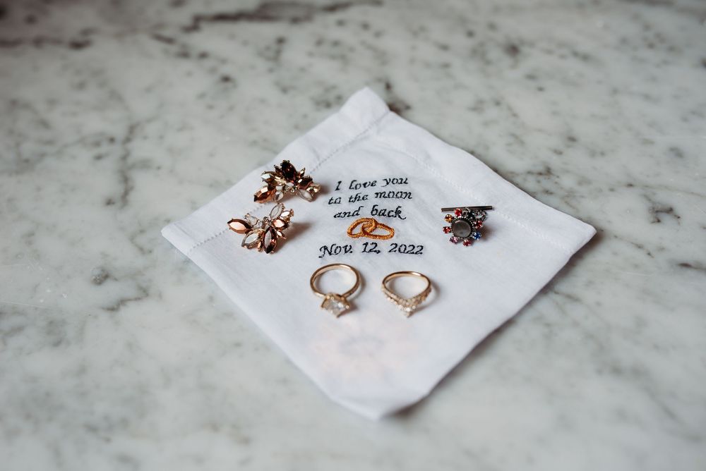 wedding details on marble slab during a winter wedding in the midwest