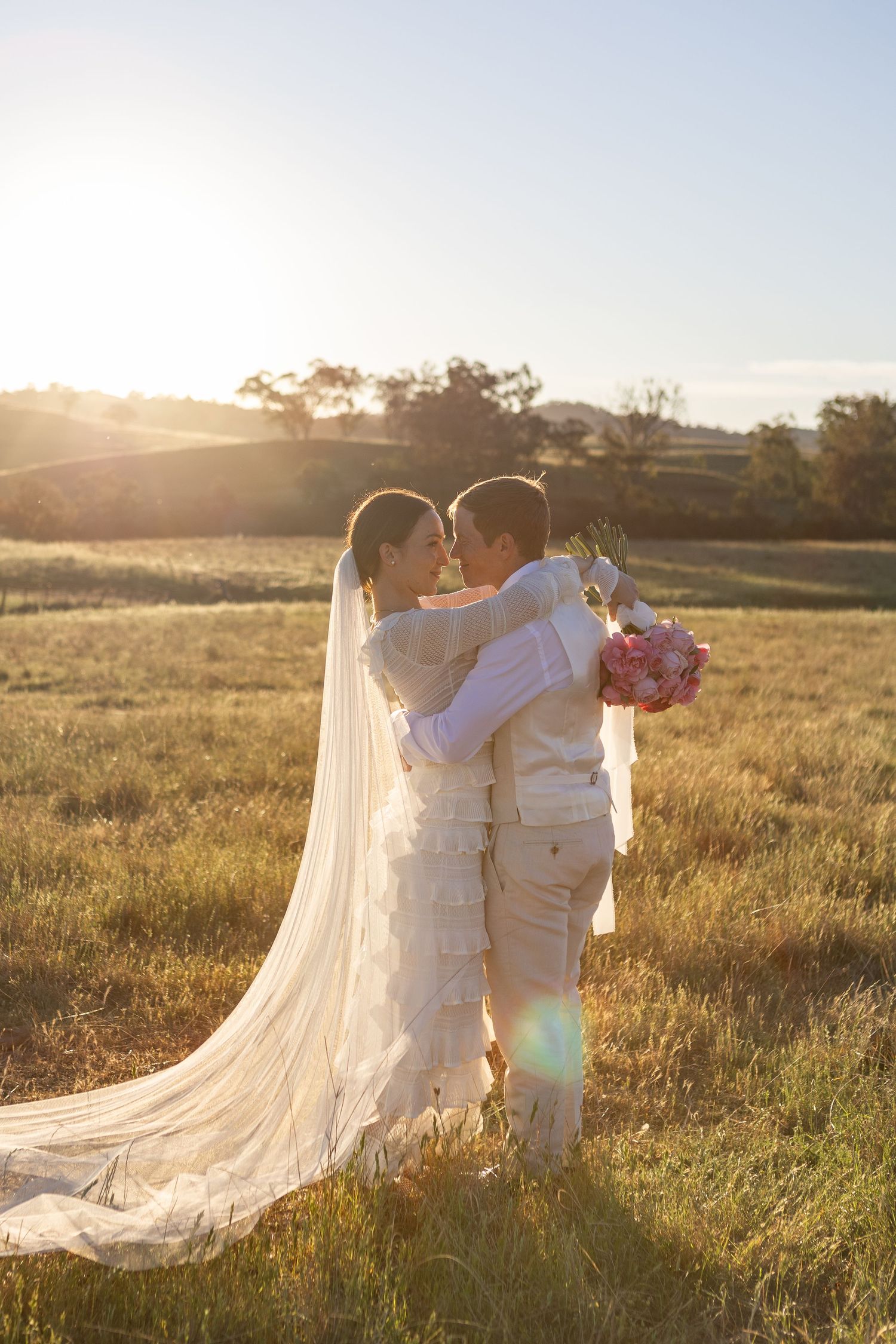 Bride and groom hugging at Scone NSW Country wedding