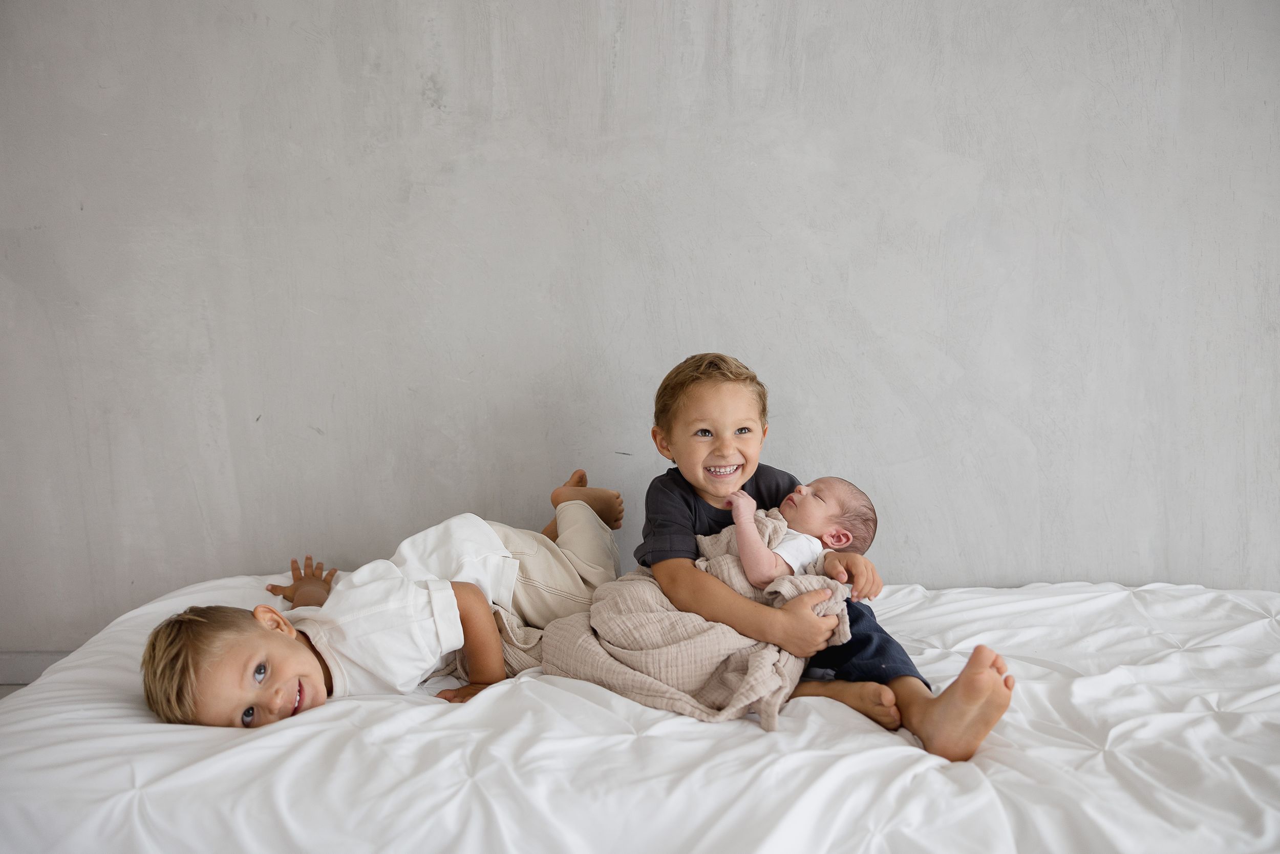 Newborn and sibling photo ideas in California studio setting