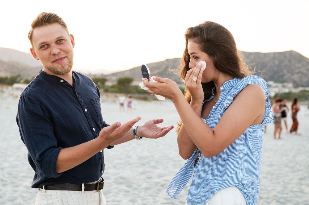 Surprise proposal sequence showing emotional reactions on a sunny beach.