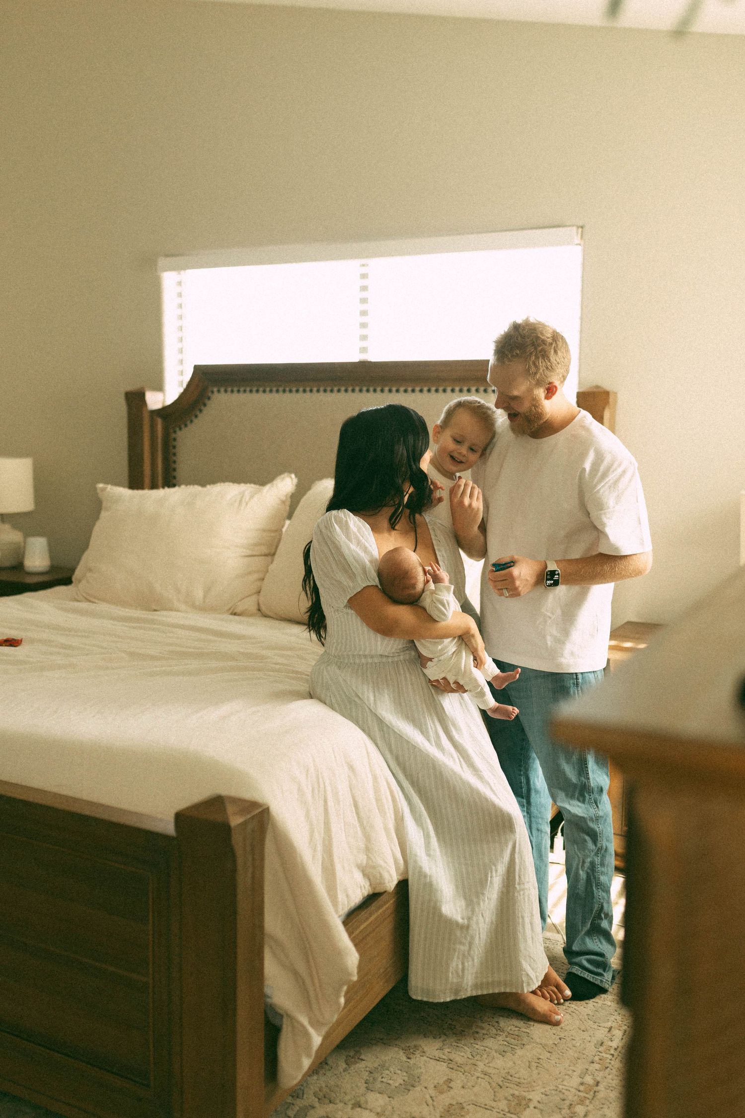 children and mom on bed