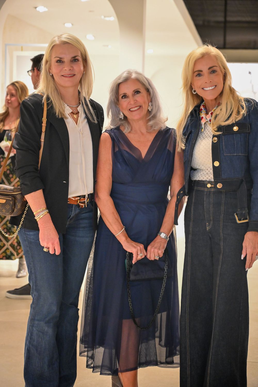 A series of photos showing women wearing navy blue and denim dresses in various styles and lengths.