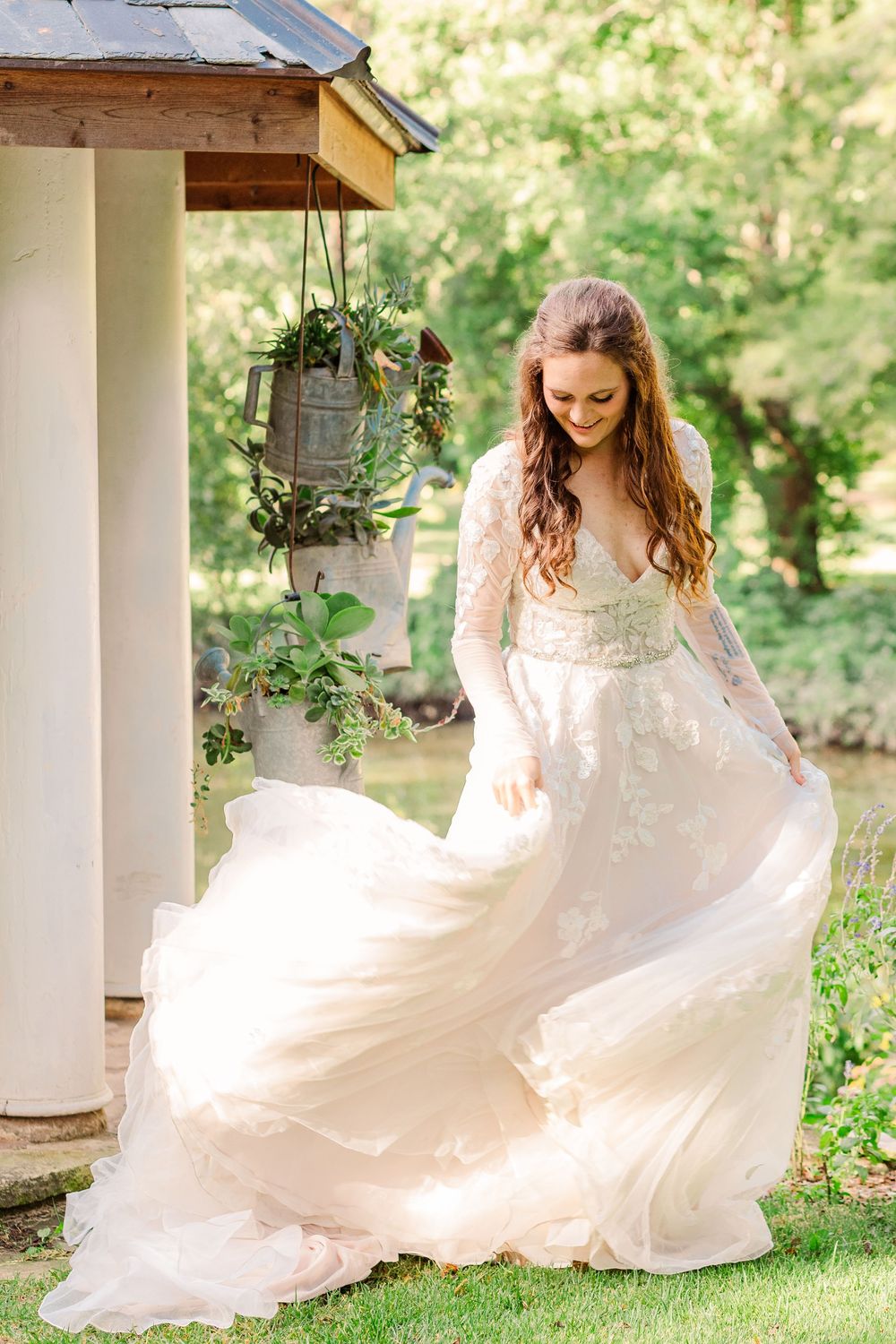 Bride twirling in her wedding dress at Bartlett Arboretum one year after her wedding.