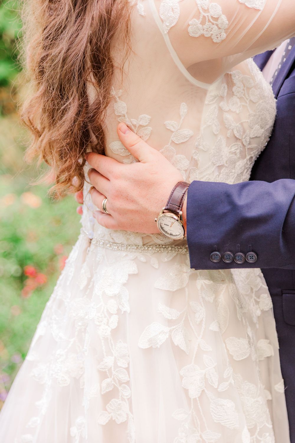 Lace wedding dress detail in natural light at Bartlett Arboretum