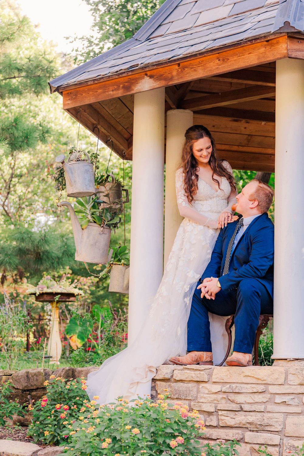 Couple laughing together during a one-year anniversary photoshoot at Bartlett Arboretum.