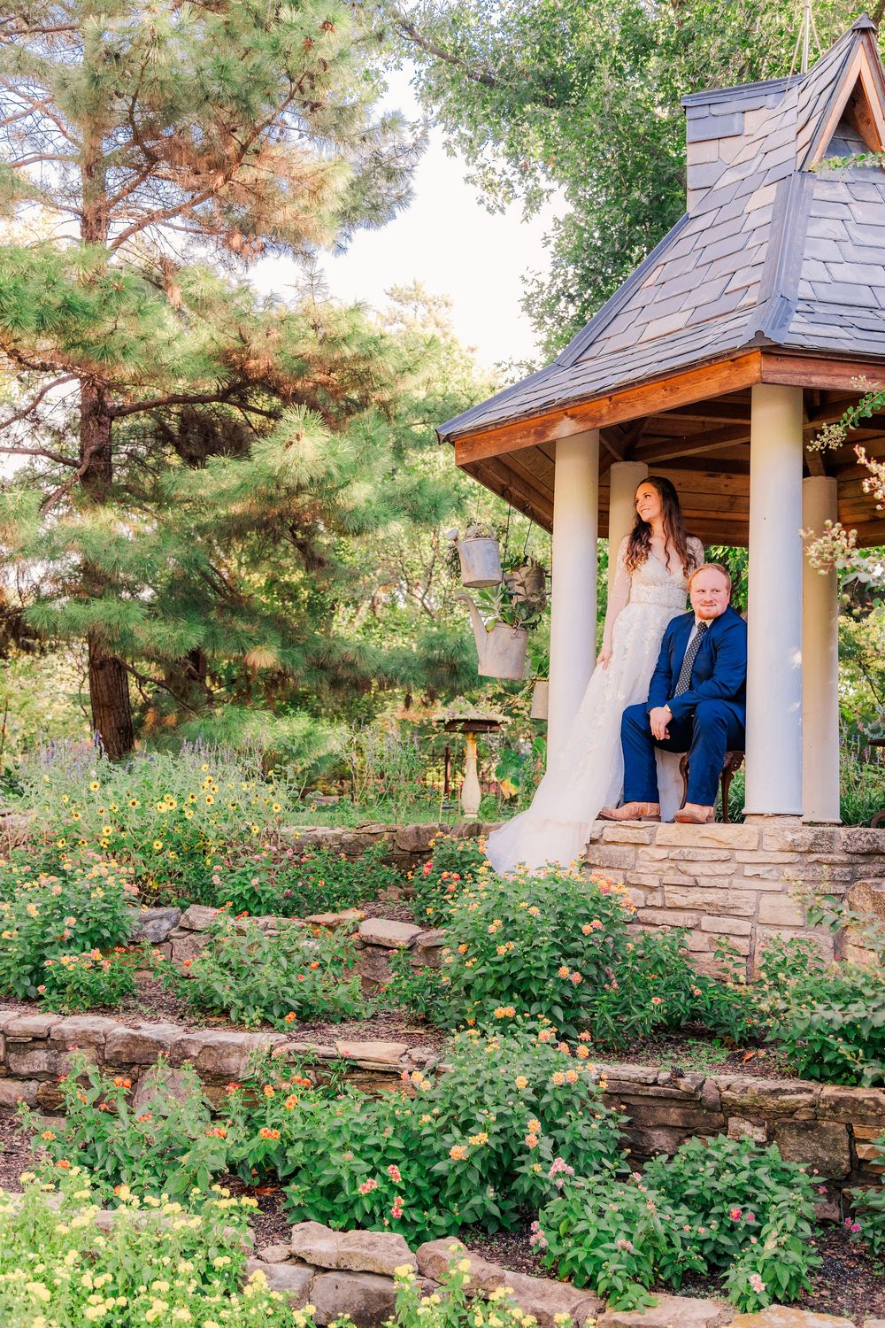 Bride and groom smiling during one-year anniversary photos at Bartlett Arboretum