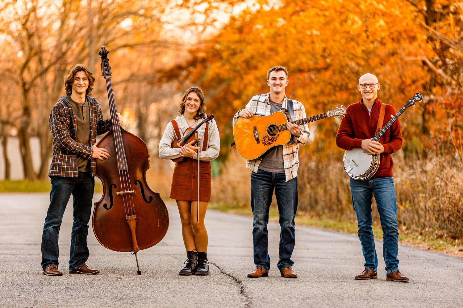 4 people with instruments outside