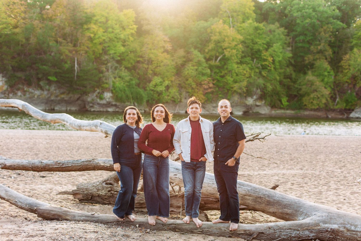 Family standing on the beach