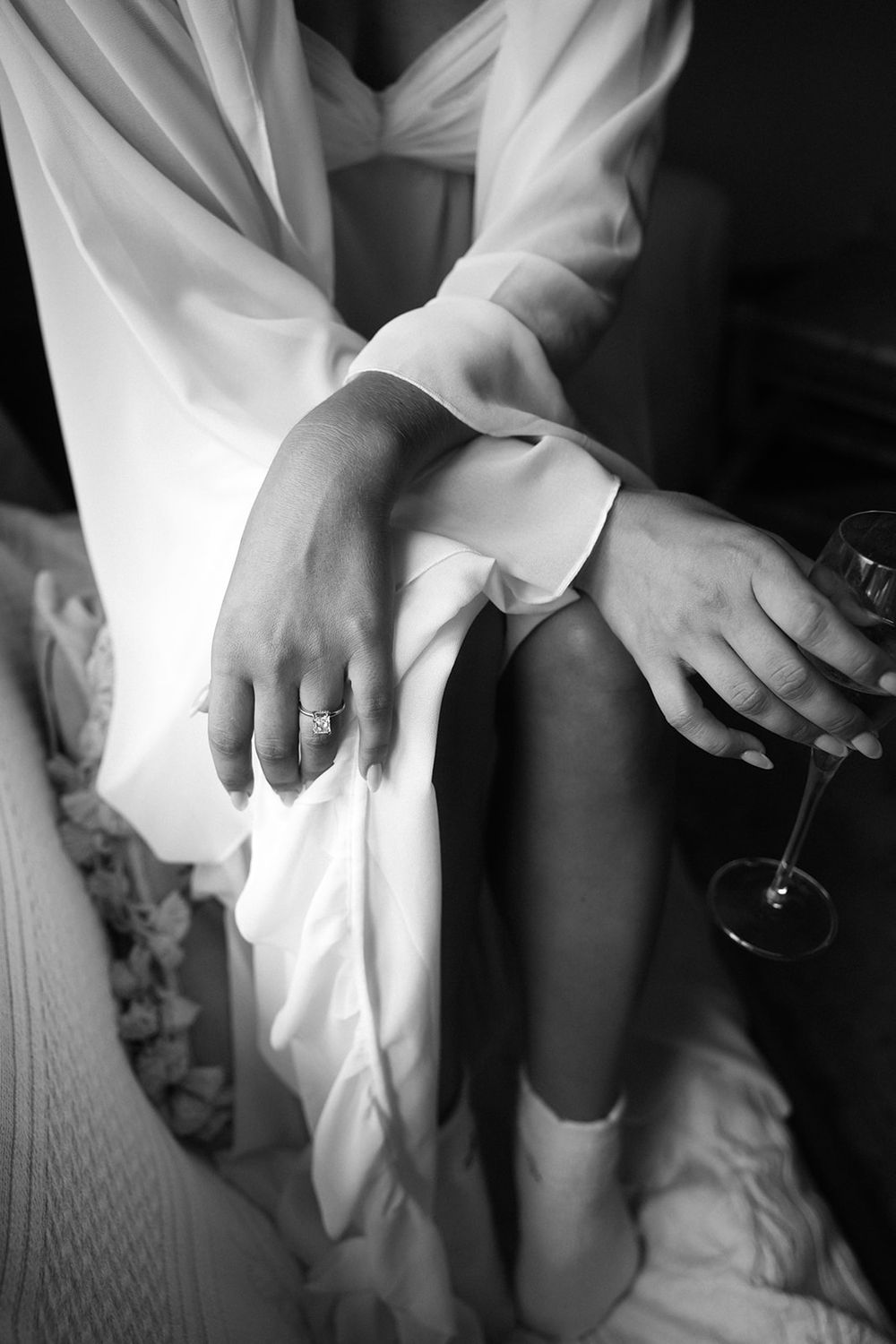 Black and white artistic photo series showing hands holding wine glasses in elegant formal attire.