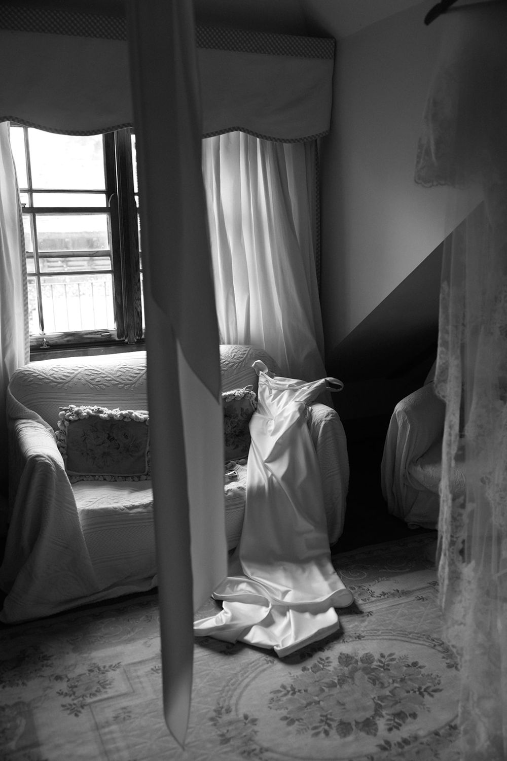 A haunting sequence of black and white photos showing a ghostly figure in white moving through a dimly lit room.