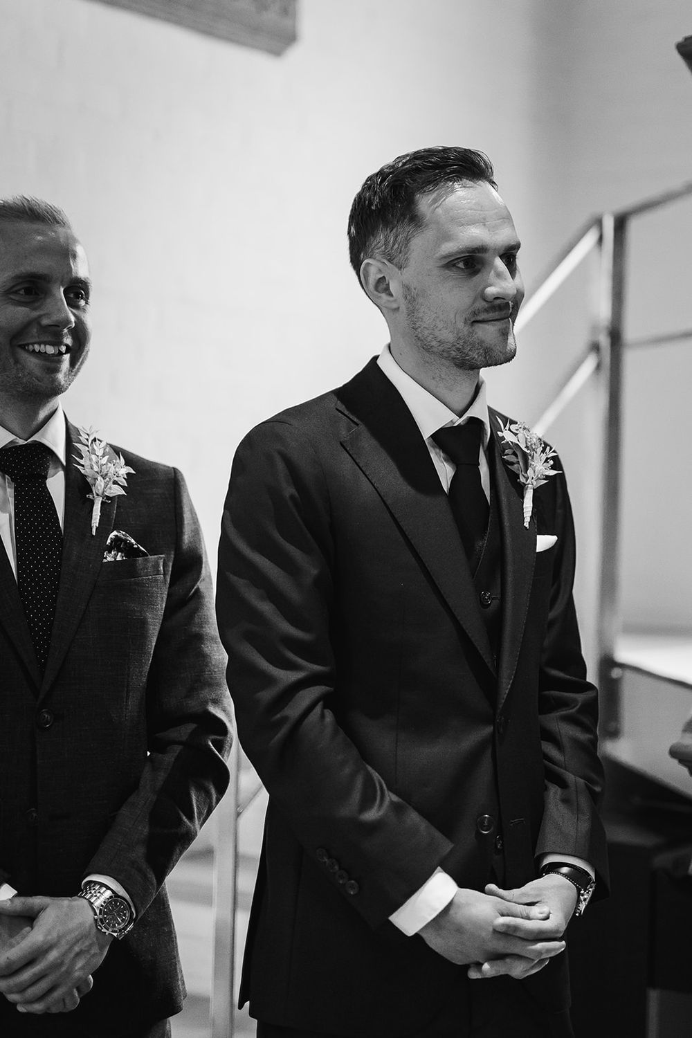 A series of black and white photos showing groomsmen in dark suits at a wedding ceremony.