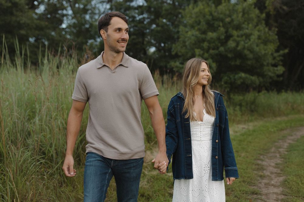 Couple walking together on a scenic nature path.