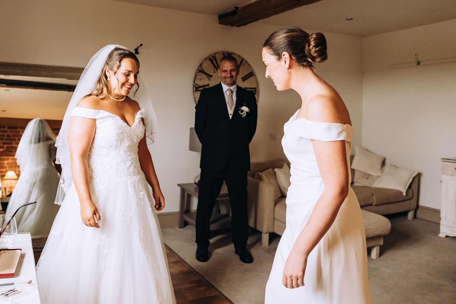 Wedding preparations in a room with exposed brick walls and natural lighting.