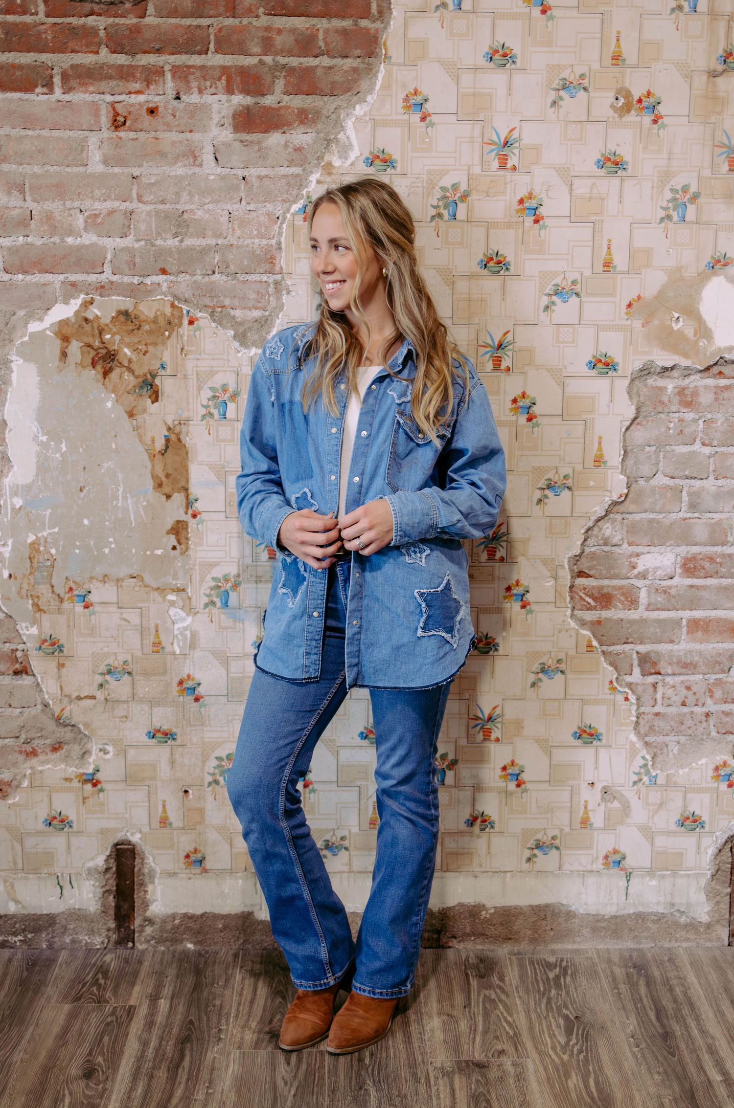 True West Photography - Fashion photos showing denim outfit styled against vintage brick and wallpaper backdrop.