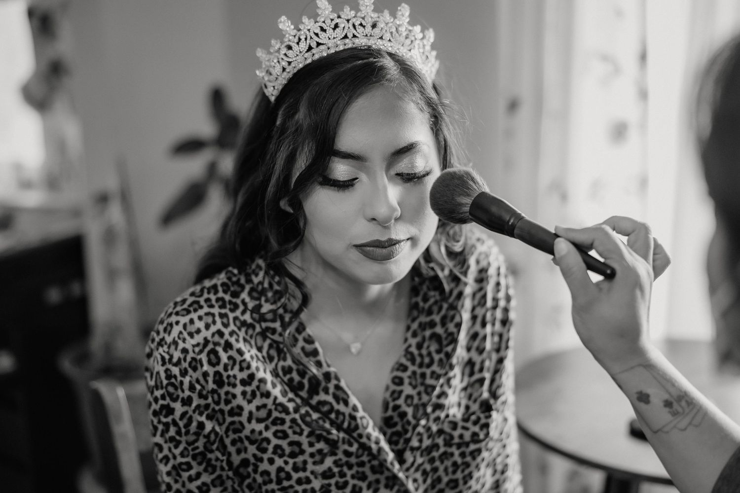 Pilar getting hair and makeup done for her quinceañera at home in Sacramento