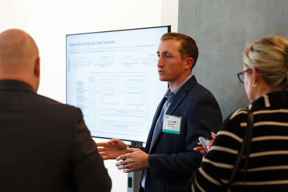 Speaker presents information to attendees during a professional business workshop.