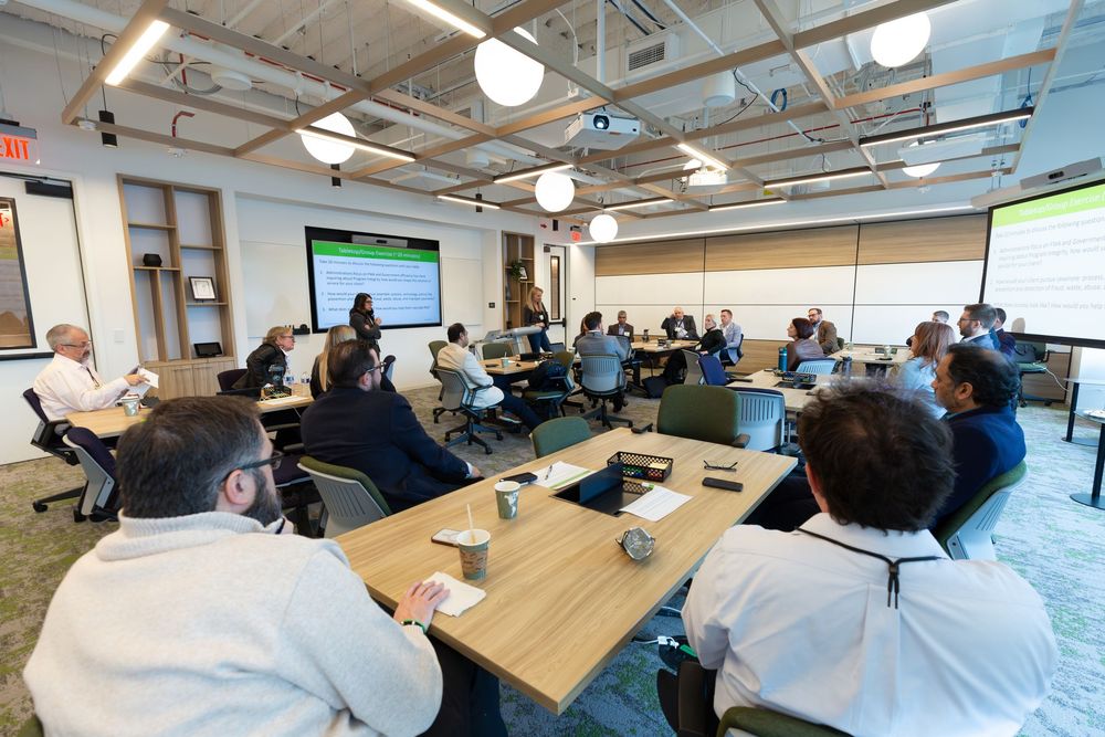 Business training session in modern classroom with projected presentation.